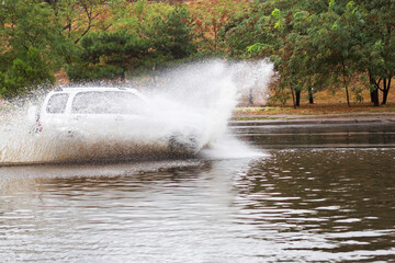 Driving cars on a flooded road during flooding caused by torrential rains. Cars float on water flooded streets. The disaster in Odessa, September 20, 2016.
