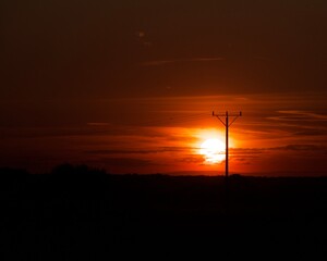 słup energetyczny na tle zachodu słońca Sunset high voltage pole