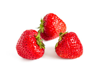 Red ripe strawberries with green sepals