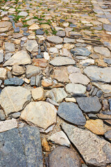 Urban stone paving, perspective. Texture, background, selective focus