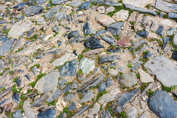 Urban stone paving stones. Texture, background, selective focus