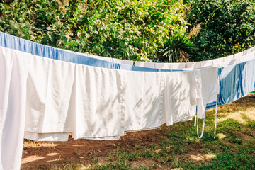 Drying laundry on washing line in garden