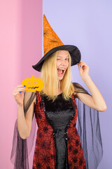 Happy Halloween. Halloween concept. Trick or treat. Halloween girl. Halloween Witch with paper...
