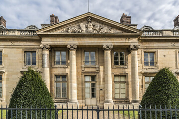 Architectural fragments of old building of Military School (Ecole Militaire, founded by Louis XV in 1750). Champ de Mars, Paris, France.