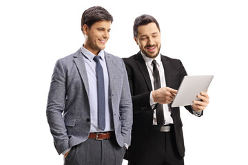 Fototapeta na wymiar Two pofessional men looking at a digital tablet device