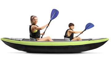 Young mother and son paddling in a kayak
