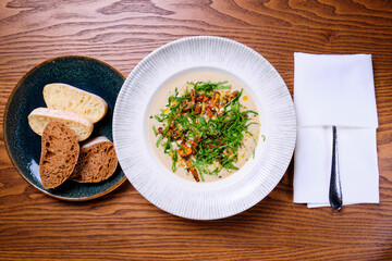 Mushroom cream soup aand bread. Top view.