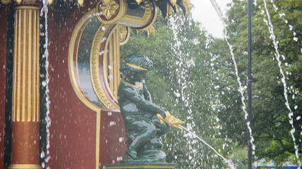 statuette in a water fountain