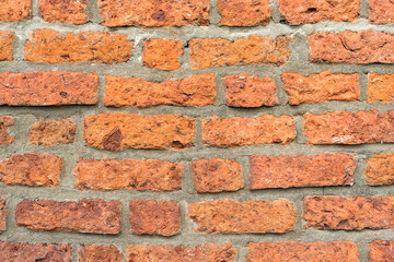 Full frame of rough brick wall close up as background