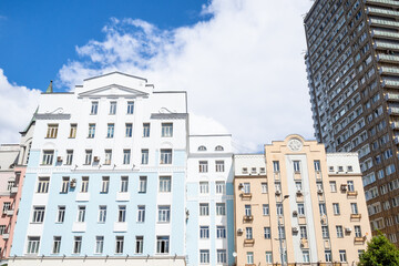 Fototapeta na wymiar colored facades of apartment houses on New Arbat Avenue in Moscow city on sunny summer day