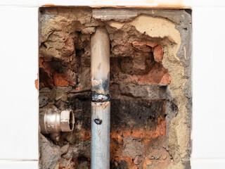 repairing of plumbing riser of heated towel rail at home - new pipe welded into water pipe and...