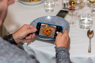 Guest tsking a photo of their stunning plate