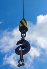 The crane hook on blue sky