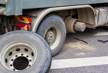 Wheel hub and truck tire in process of changing wheel nut. Maintenance a truck wheels hub and...