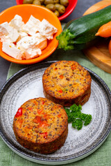 Tasty vegetarian food, burgers with Greek feta cheese, sweet red paprika, green olives and zucchini