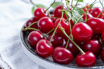 Obraz na płótnie Canvas New harvest of red ripe juicy sour cherry or kriek berry