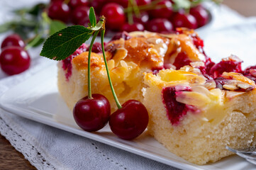 Fresh baked cake with red ripe juicy sour cherry or kriek berry