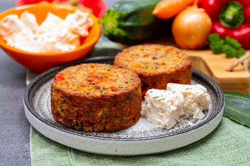 Tasty vegetarian food, burgers with Greek feta cheese, sweet red paprika, green olives and zucchini