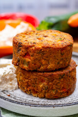 Tasty vegetarian food, burgers with Greek feta cheese, sweet red paprika, green olives and zucchini
