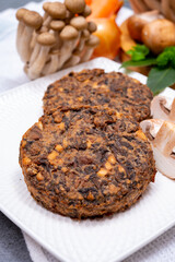 Tasty vegetarian food, burgers with champignons mushrooms, buna shimeji, carrot and onion