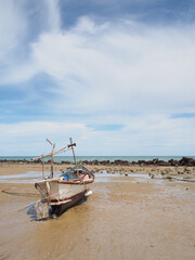 Small fishing boats of villagers in the area parked on Phla beach, Rayong province after going out...