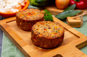 Tasty vegetarian food, burgers with Greek feta cheese, sweet red paprika, green olives and zucchini