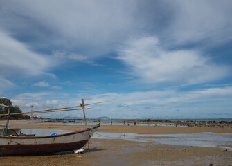 Small fishing boats of villagers in the area parked on Phla beach, Rayong province after going out...