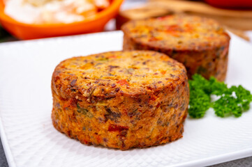 Tasty vegetarian food, burgers with Greek feta cheese, sweet red paprika, green olives and zucchini
