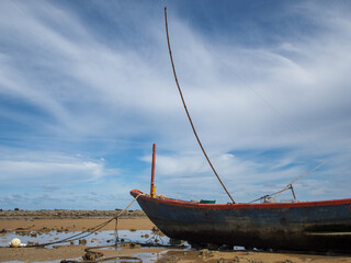 Small fishing boats of villagers in the area parked on Phla beach, Rayong province after going out...