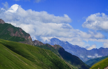 Summer mountains green grass and blue sky landscape