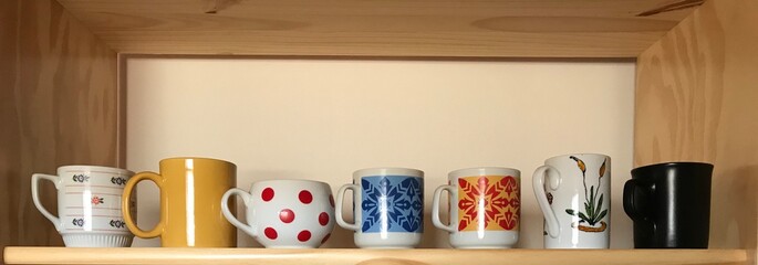 Collection of Mugs on a Shelf