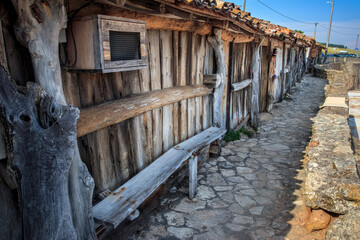 Fototapeta na wymiar Wooden houses where salt used to be kept in the salt flats of Rio Maior, in Portugal.