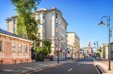 Ancient buildings and the bell tower of the Trinity Church on Pyatnitskaya Street in Moscow