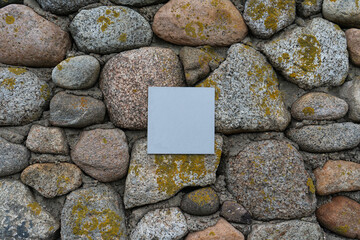 Old stone wall with metal plate in centrum.
