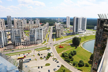 Naklejka na ściany i meble Panorama of a large modern city on a warm summer day. Modern architecture. Urban life concept.