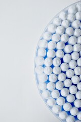 Ear sticks with blue plastic on a white background. Personal hygiene and self-care. Cosmetology and medicine.