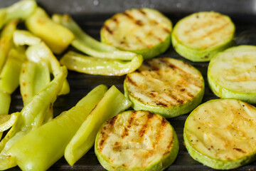 Grilled vegetables in a pan. Close-up of zucchini and sweet peppers