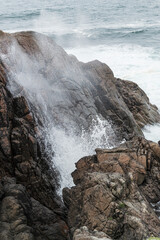 Waves crashing on a rocky coast in Donegal, Ireland.