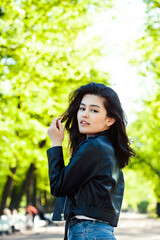 Fototapeta premium pretty young asian woman smiling cheerful in green park on summer sunny day, lifestyle people concept