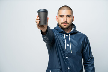 man holding a glass of coffee