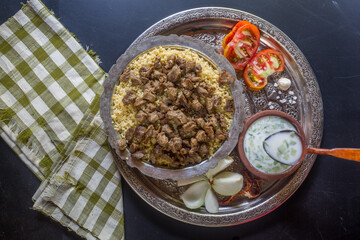 An Anatolian culture dish, bulgur pilaf and bean dish at the table