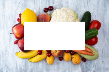 Fresh and bright fruits and vegetables on a light background. View from above.