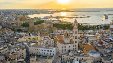 Beautiful panoramic aerial view photo from flying drone at sunset to Bari old town ,Cathedral Saint...