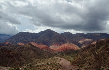 Fototapeta premium Desert landscape. Aerial view of the colorful mountains and valley in Tilcara, Argentina.
