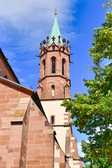 Fototapeta na wymiar Ladenburg, Germany, Tower of gothic architecture style catholic church called 'St. Gallus' in Ladenburg in the Rhein-Neckar district in Germany