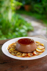 Gastronomy. Chocolate mousse with kiwi fruit sauce.