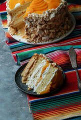 Uruguayan cake chaja: the famous sponge cake from Uruguay,  sponge cake stuffed with syrup, dulce de leche, whipped cream and peaches.
