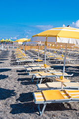 Fototapeta na wymiar Beach beds and umbrellas, Italy