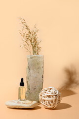 SPA cosmetic oil on beige in monochrome creative composition. Natural skin care concept. Wellness.