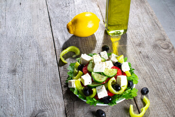 Greek salad with fresh vegetables, feta cheese and olives. top view.
